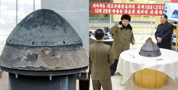 북한이 공개한 탄도로켓(미사일)의 전투부(탄두 부분) 추정 물체. 김정은 북한 국방위원회 제1위원장이 이 물체를 살펴보고 있다. (사진 북한 ‘노동신문’)