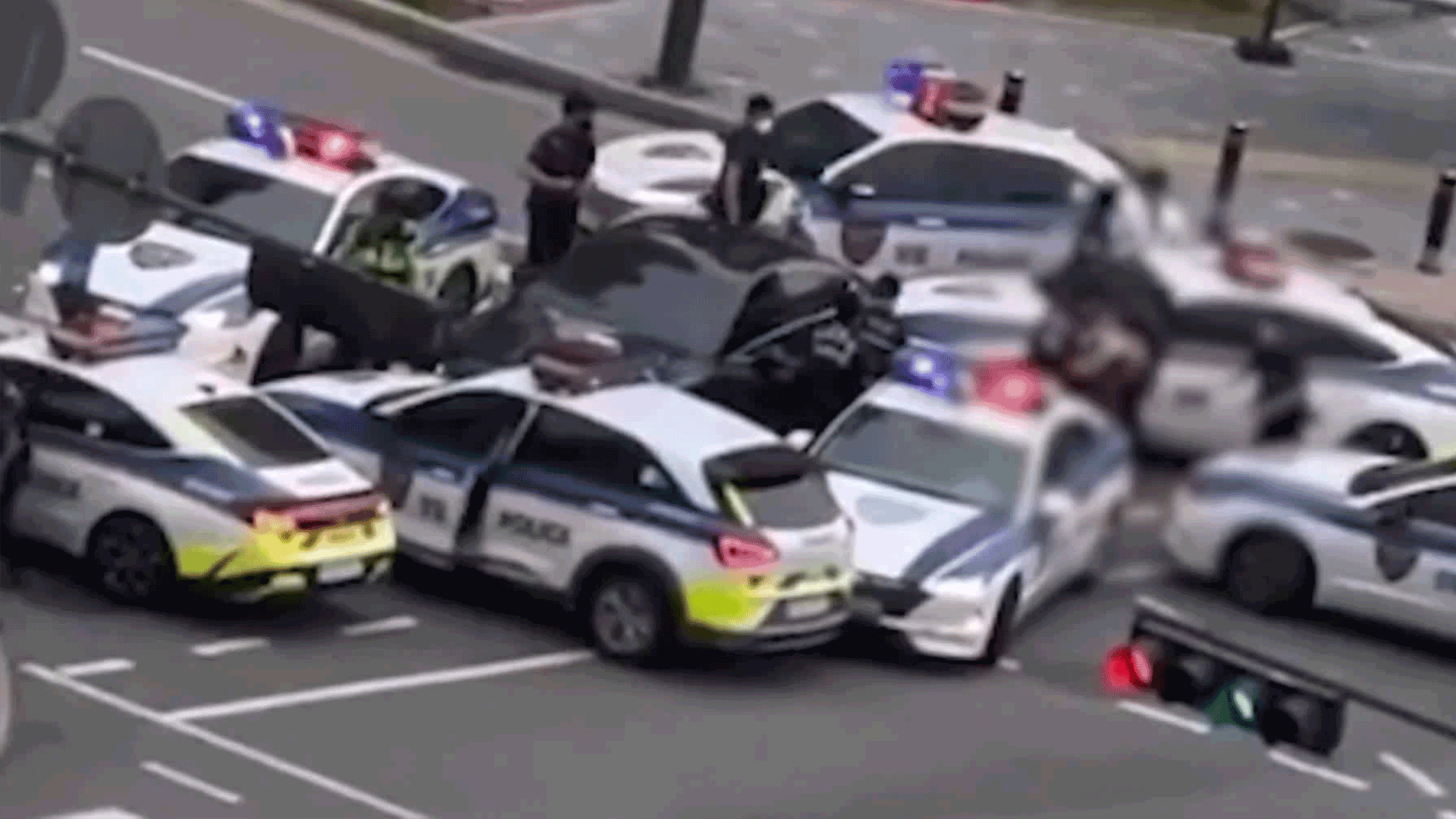 Woman crashes into 6 patrol cars