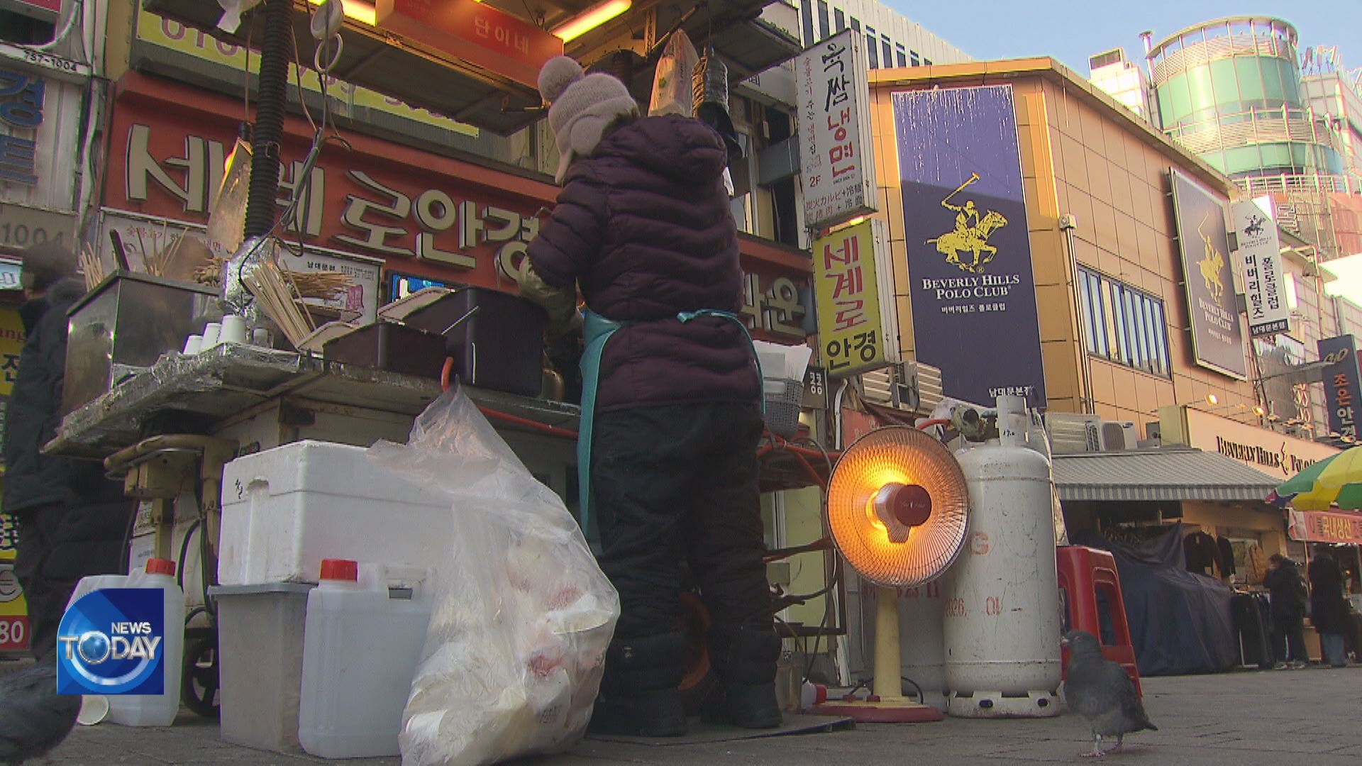 MERCHANTS, HOMELESS HIT BY RECORD COLD WAVE