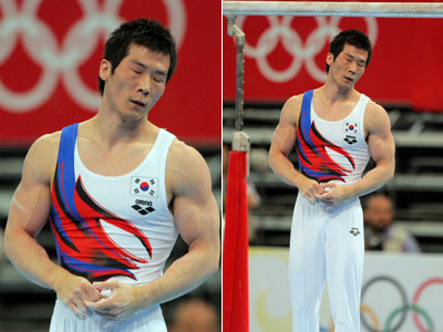 19일 베이징 국가실내체육관에서 열린 2008 베이징올림픽 체조 남자 평행봉 결승에서 양태영이 착지를 한 뒤 자신의 연기에 만족을 못한 듯 아쉬운 표정을 짓고 있다. 양태영은 전체 8명 중에서 7위를 차지했다. 