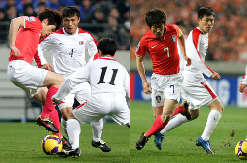 1일 서울월드컵경기장에서 벌어진 2010년 남아공월드컵 아시아예선 한국-북한전에서 박지성이 북한 박남철(4), 문인국(11) 사이로 공을 빼내며 드리블하고 있다. 